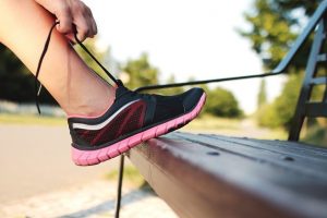 The ideal shoe is snug but not overly tight. Wear the socks that you plan to work out in when trying on shoes.